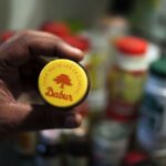 Dabur share price falls over 4% after Q4 results 2025, dividend. Should you buy or sell?