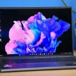 Acer Swift Go 16 laptop on a wooden desk