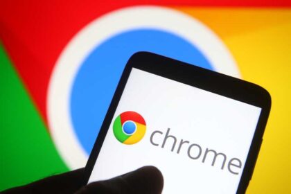 Chrome logo on phone in front of larger Chrome display in background
