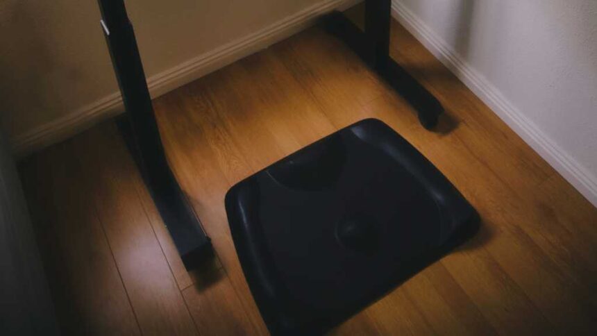 Topo Comfort Mat under a standing desk on wooden floor