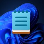 Windows 11 Bloom background with Notepad icon