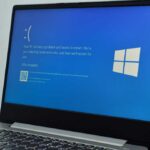Windows 11 laptop with Blue Screen of Death BSOD hero
