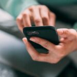 person using phone iphone smartphone